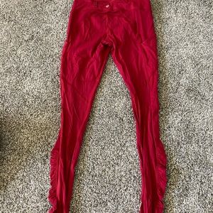 Lululemon leggings with side pockets with mesh material over the back of legs